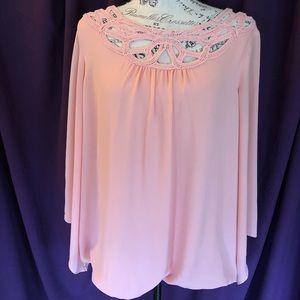 Peach color blouse with neckline detail